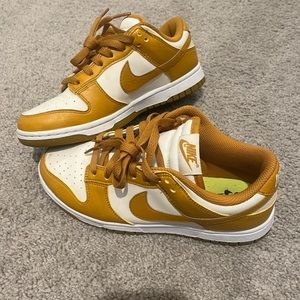 Gold and white Nike dunks